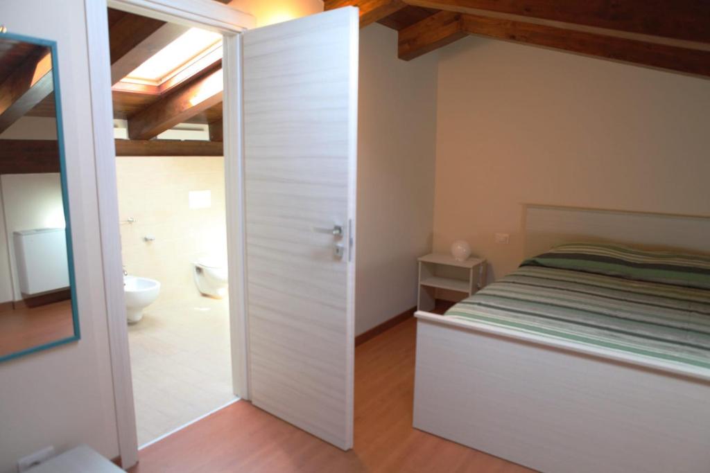 Postel nebo postele na pokoji v ubytování B&B ARCOBALENO