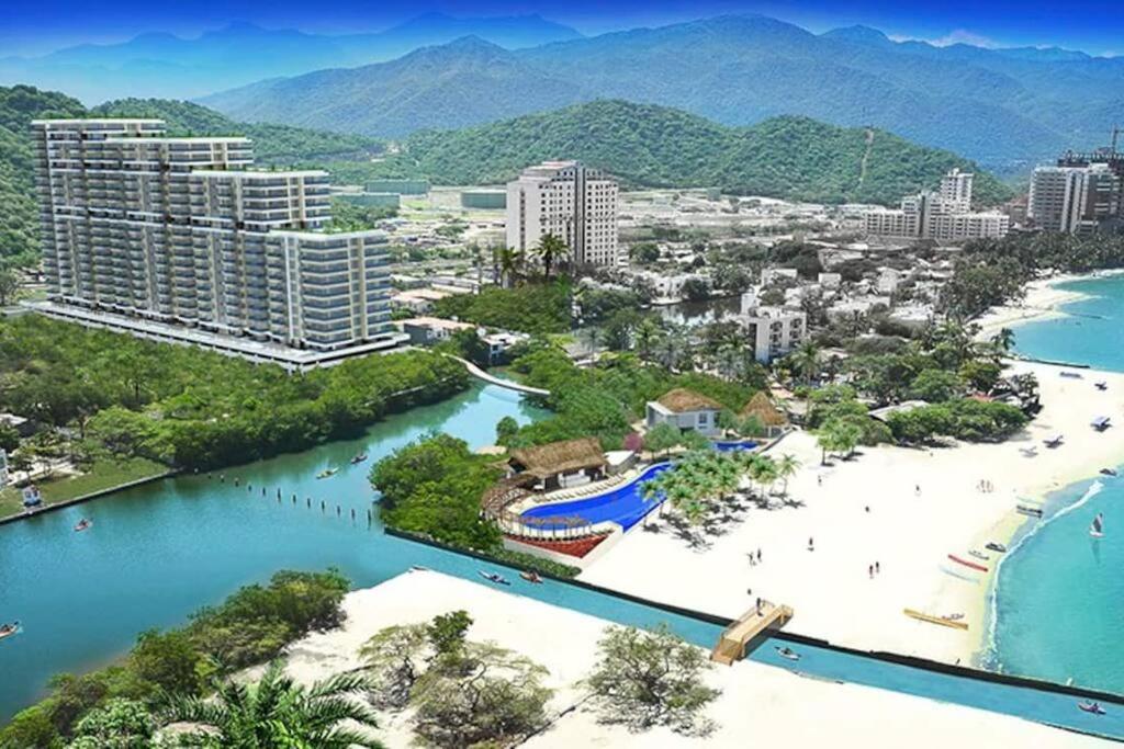 an aerial view of a resort and a beach at Apartamento Encantador Samaria Club de playa, 3 alcobas 6 personas Playa Privada in Santa Marta