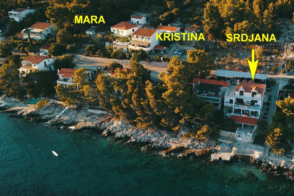 an aerial view of a resort next to the water at Apartmani Srdjana in Prizba