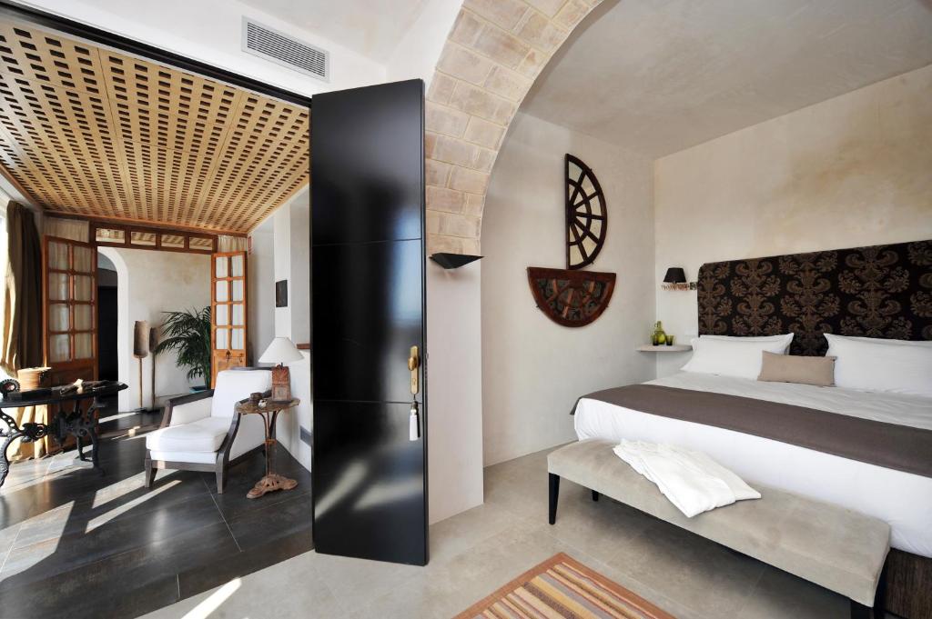 Een bed of bedden in een kamer bij Hotel Boutique V