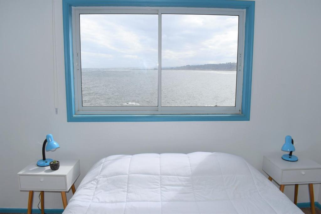 Postel nebo postele na pokoji v ubytování Bahía Luz Hostal