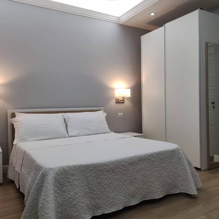 Postel nebo postele na pokoji v ubytování Porta d'Alpi