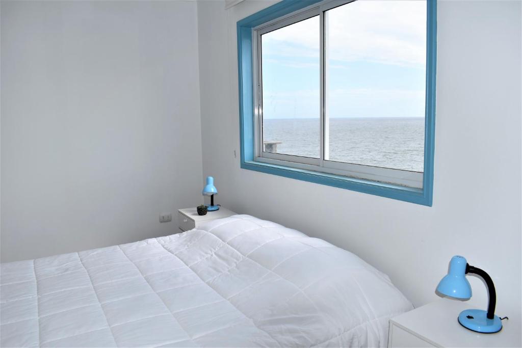 Postel nebo postele na pokoji v ubytování Bahía Luz Hostal