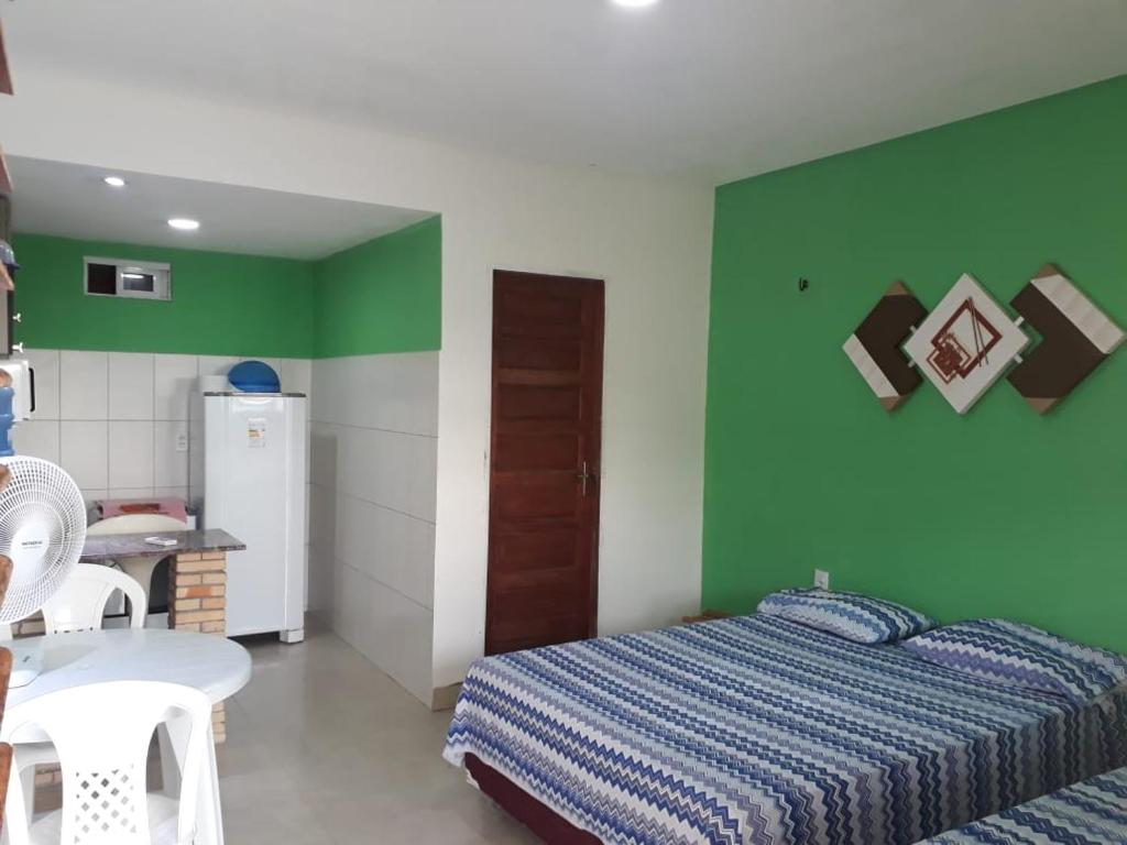 Giường trong phòng chung tại Pousada Chalés do Castelo
