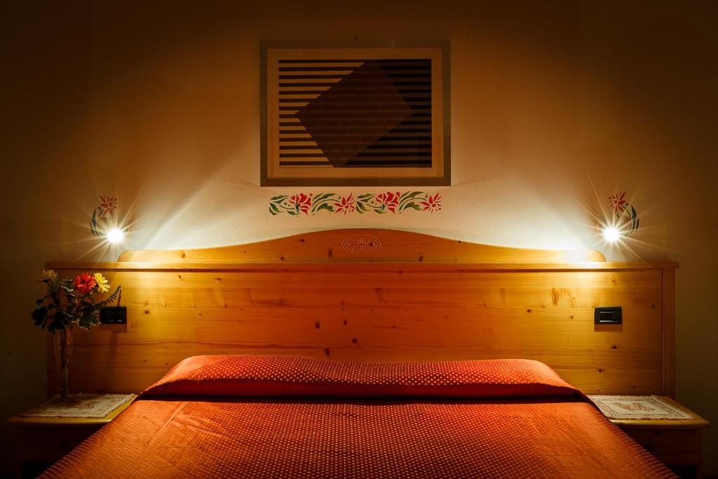 Postel nebo postele na pokoji v ubytování HOTEL La Locanda