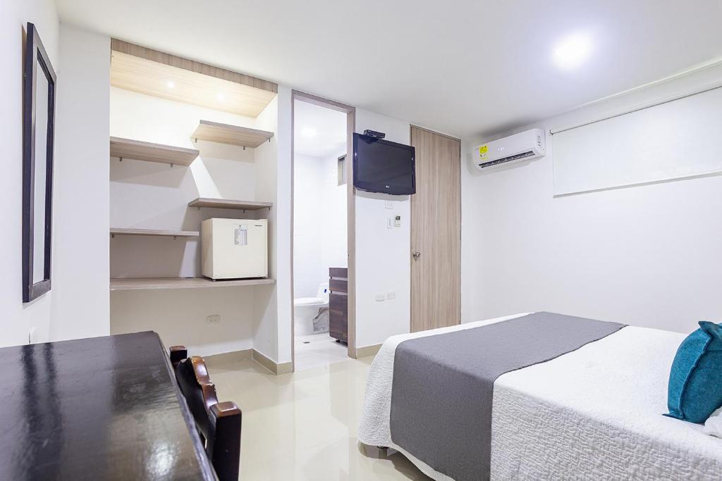 TV a/nebo společenská místnost v ubytování Hotel Ancor