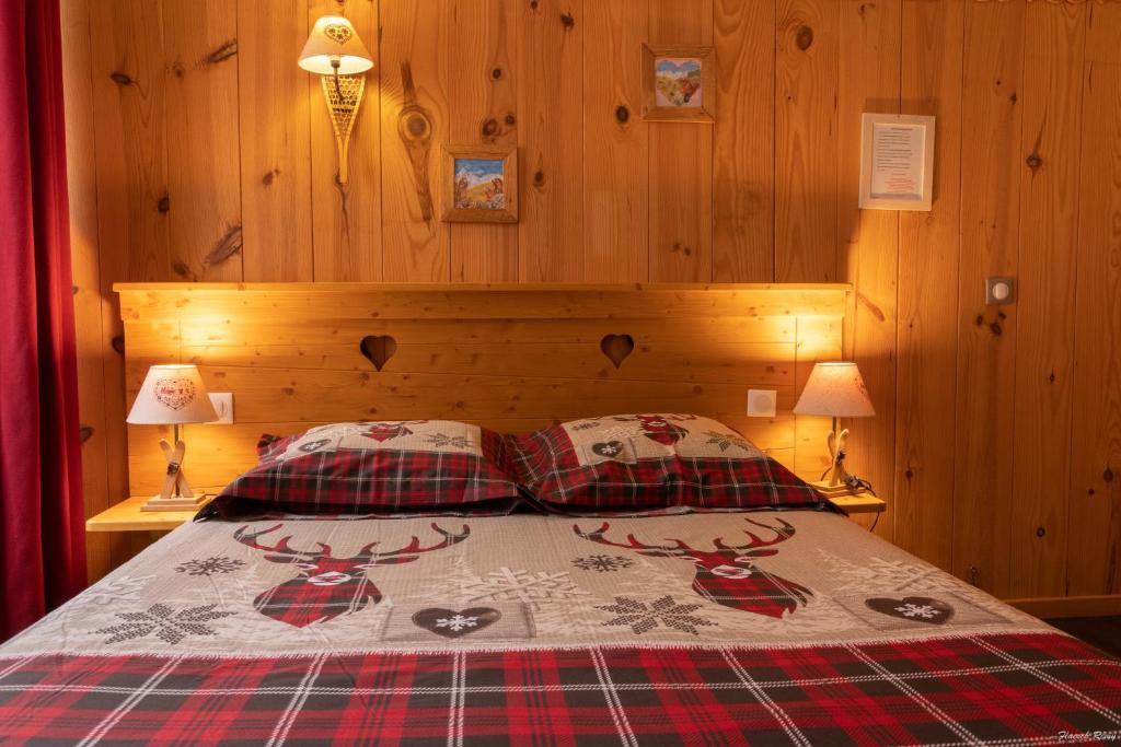 Postel nebo postele na pokoji v ubytování Hôtel Quin Te Va