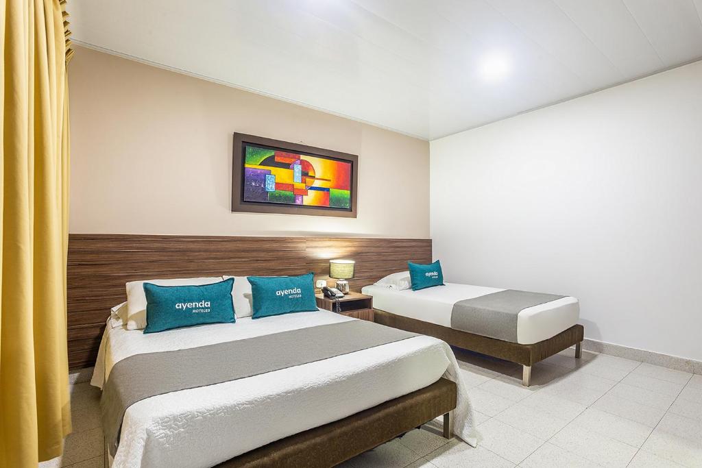 Postel nebo postele na pokoji v ubytování Hotel Ancor