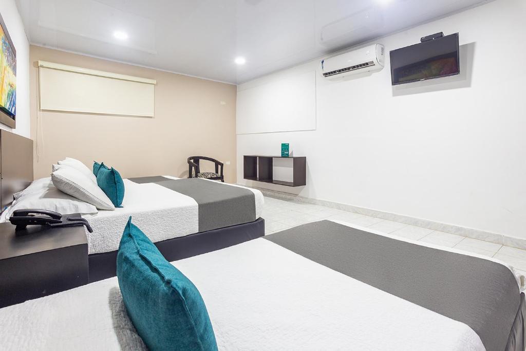 Postel nebo postele na pokoji v ubytování Hotel Ancor