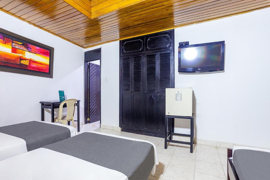 Postel nebo postele na pokoji v ubytování Hotel Ancor
