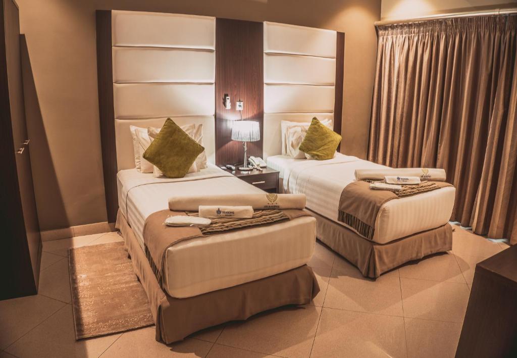 A bed or beds in a room at Seasons hotel and spa