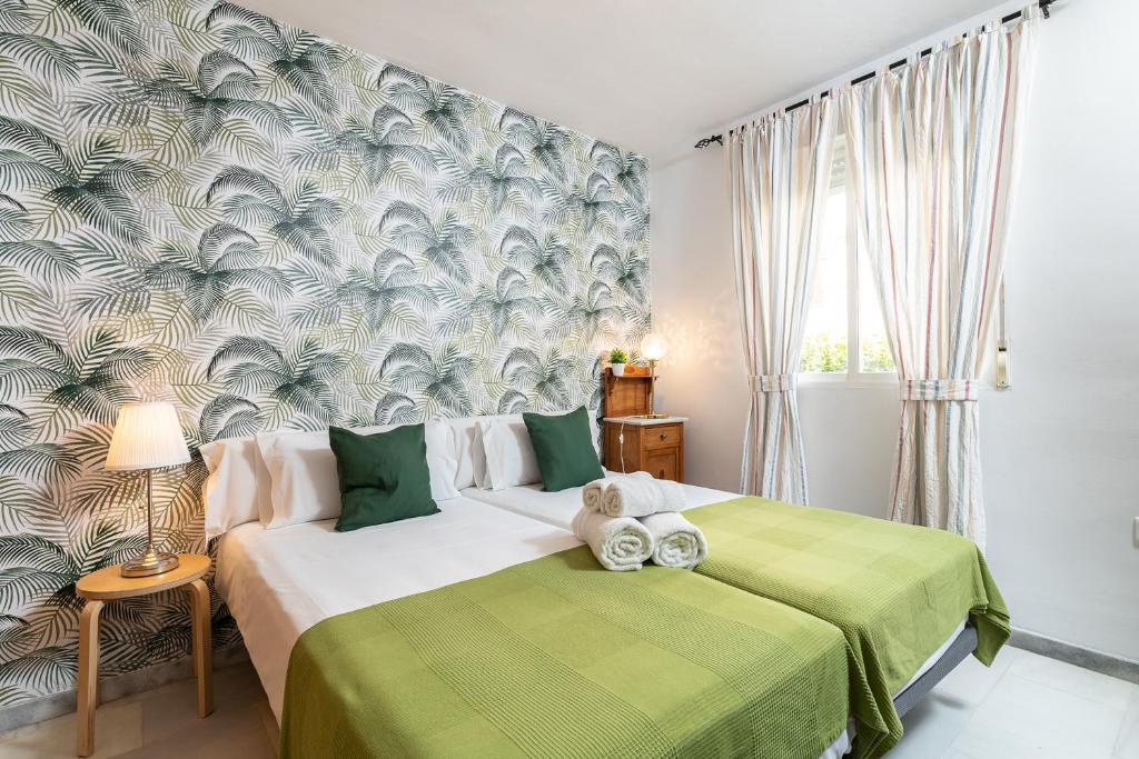 En eller flere senge i et værelse på MONKÓ LAS PALMERAS