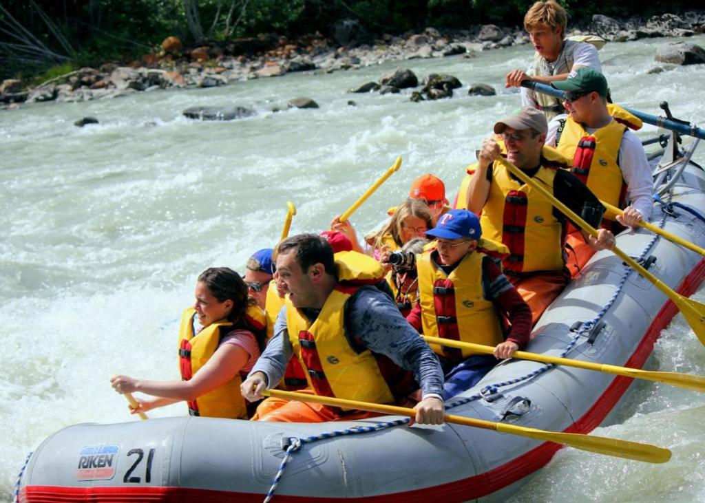 a group of people in a raft on a river at Shangri-La - Near Mendenhall Glacier and Auke Bay -DISCOUNTS ON TOURS! in Mendenhaven