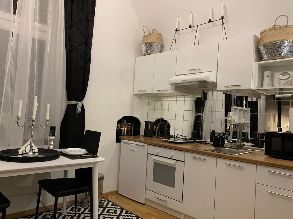 Kuchyň nebo kuchyňský kout v ubytování Apartment Aventus