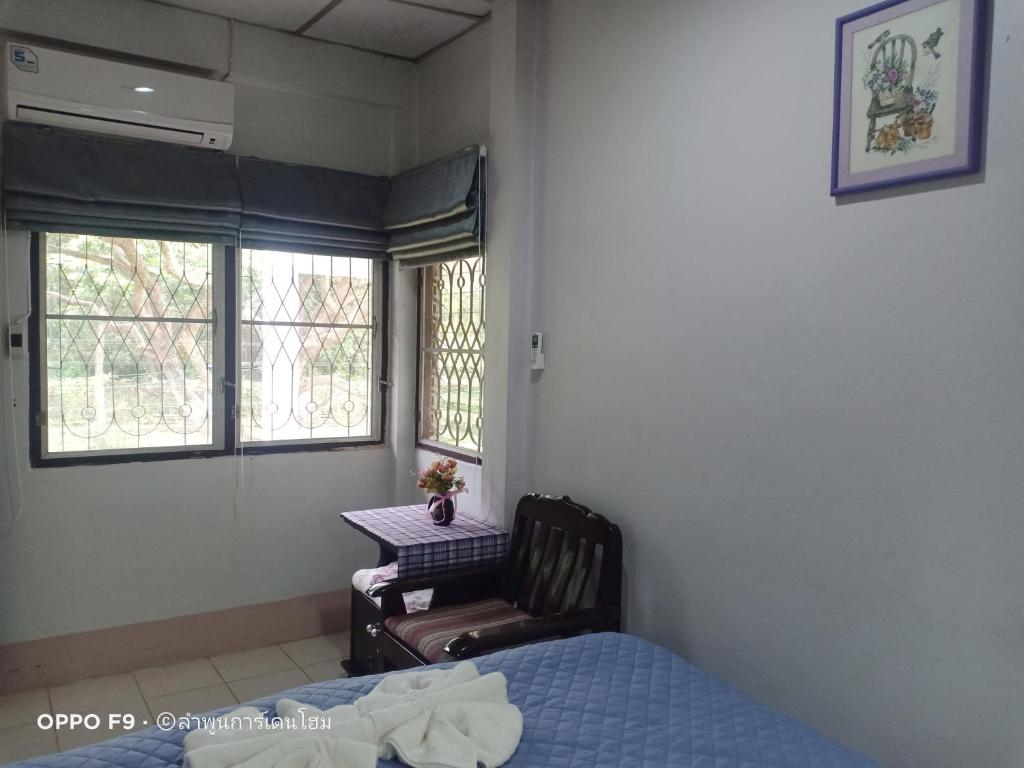 Postel nebo postele na pokoji v ubytování Lamphun Garden Home