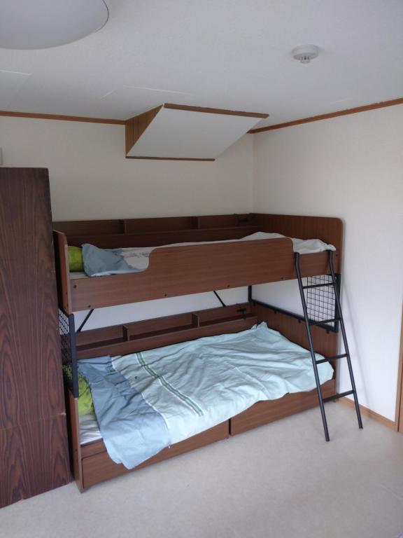 Letto o letti in una camera di コウノトリの里の宿