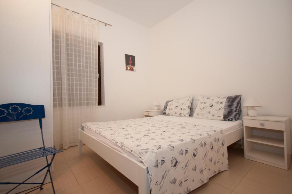 Posteľ alebo postele v izbe v ubytovaní Rooms & Apartments Bruno