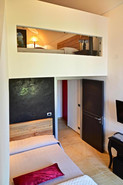 a bedroom with a bunk bed in a room at B&B Torre Porta Marina in Ventimiglia
