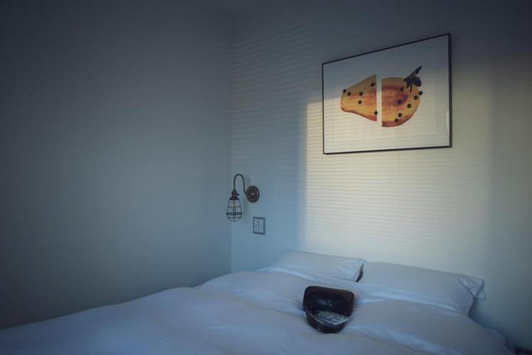 Postel nebo postele na pokoji v ubytování BENJAMIN HOTEL KANAZAWA