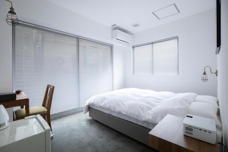 Postel nebo postele na pokoji v ubytování BENJAMIN HOTEL KANAZAWA