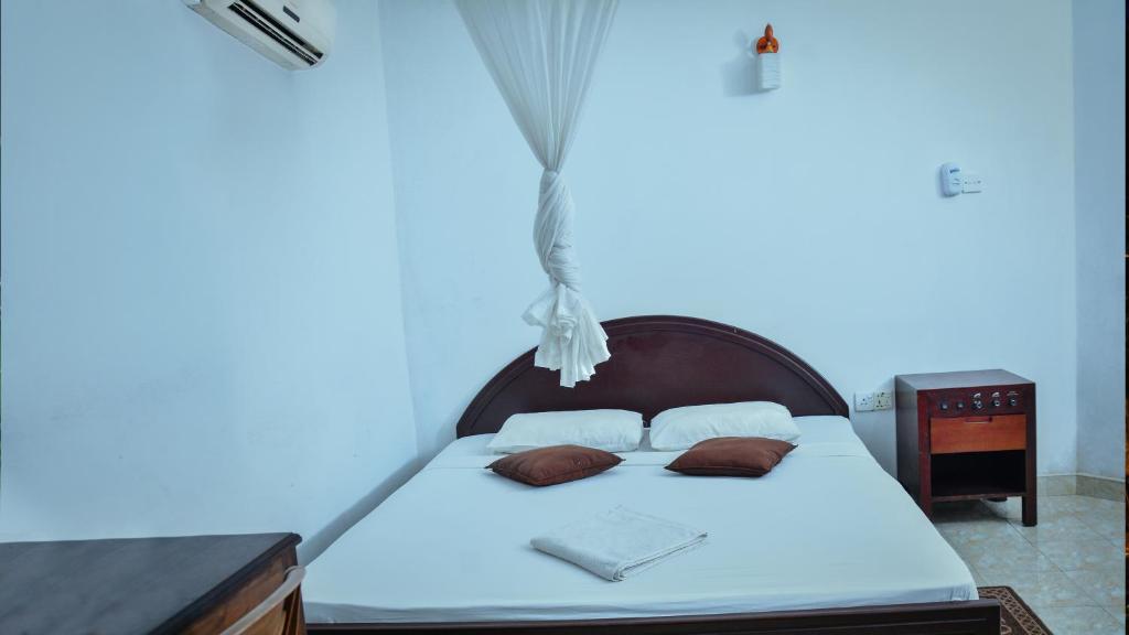 Postel nebo postele na pokoji v ubytování Gamagedara Resort