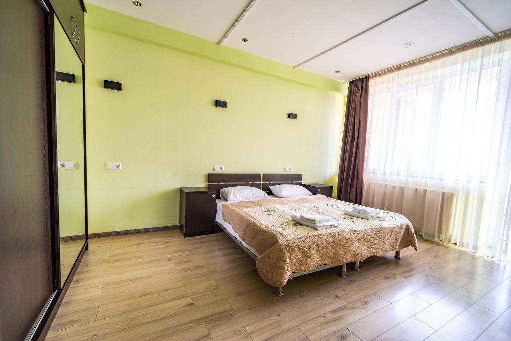 Postel nebo postele na pokoji v ubytování 2-room Apartment NFT Gudauri Penta 501