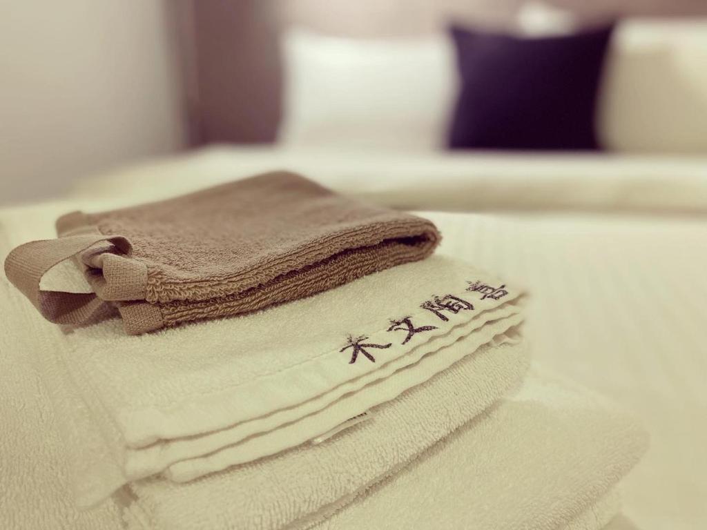Postel nebo postele na pokoji v ubytování M Taipei Hotel