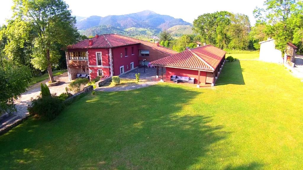 an aerial view of a house with a large yard at Hotel Rural Coviella in Coviella