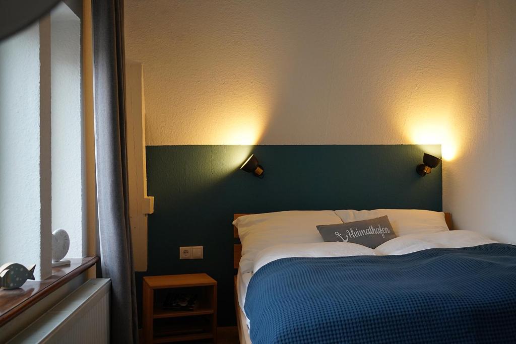 Postel nebo postele na pokoji v ubytování Stadthuuske