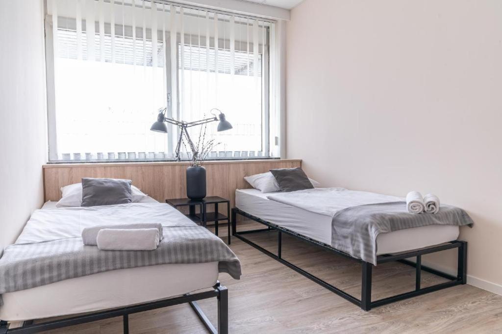 Postel nebo postele na pokoji v ubytování Hostel Messe Laatzen