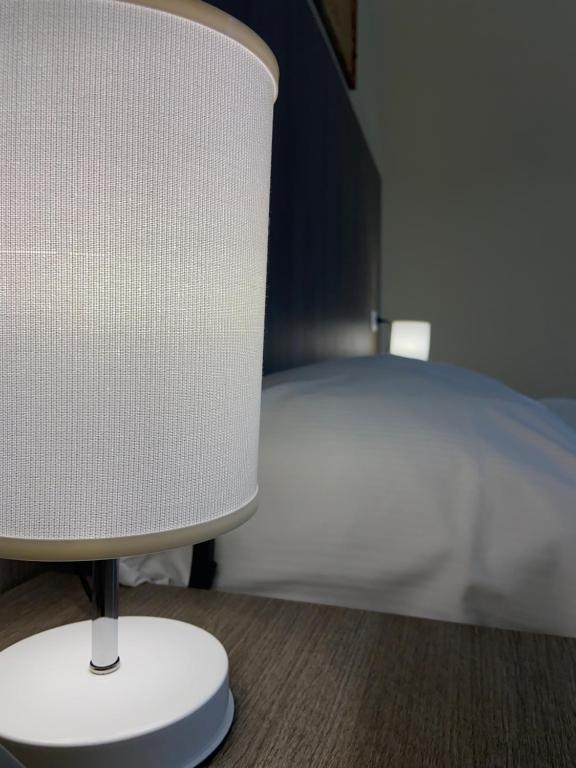 Postel nebo postele na pokoji v ubytování 55 Aira Hotel