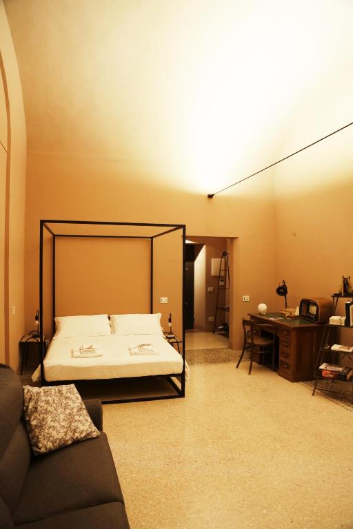 Posteľ alebo postele v izbe v ubytovaní Atelier Pallavicini Suites