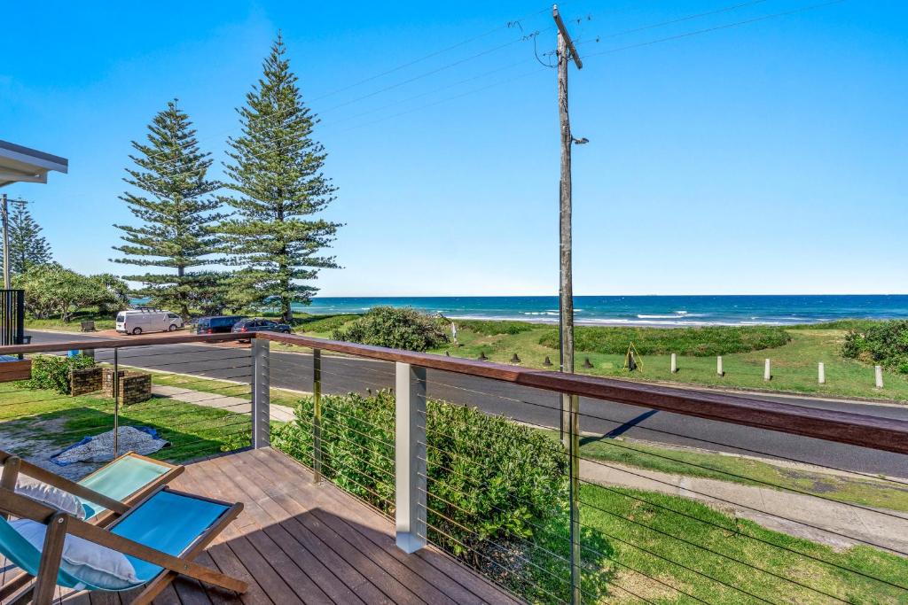 a deck with a view of the ocean at Surfside - Lennox Head in Lennox Head