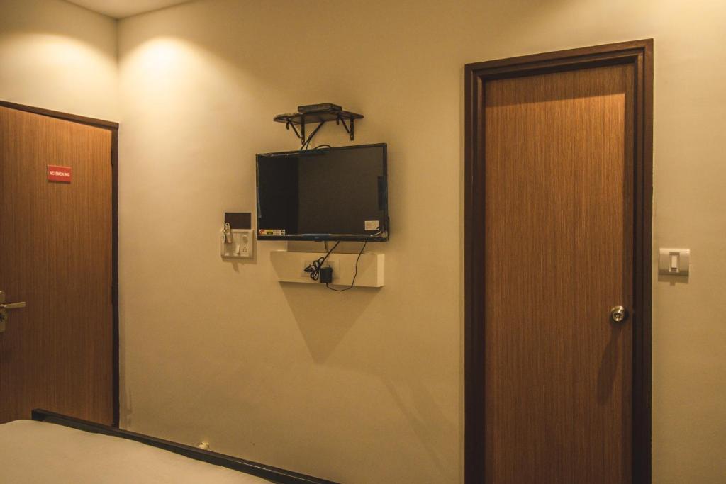 TV a/nebo společenská místnost v ubytování Amber Rooms