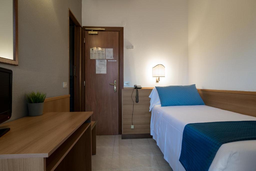 Postel nebo postele na pokoji v ubytování Hotel Pacific