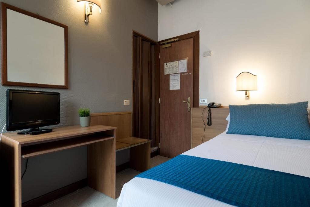 Postel nebo postele na pokoji v ubytování Hotel Pacific