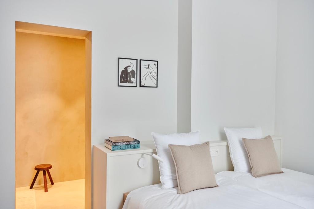 Postel nebo postele na pokoji v ubytování Edgar Guesthouse