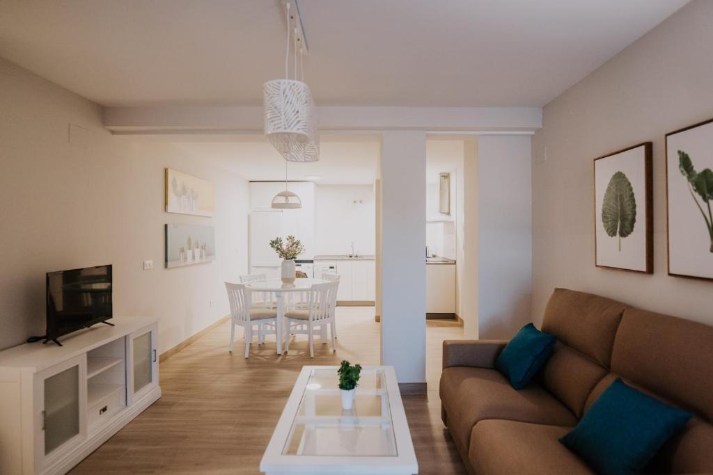 a living room with a couch and a table at San Rafael 4- Parking gratuito in Córdoba