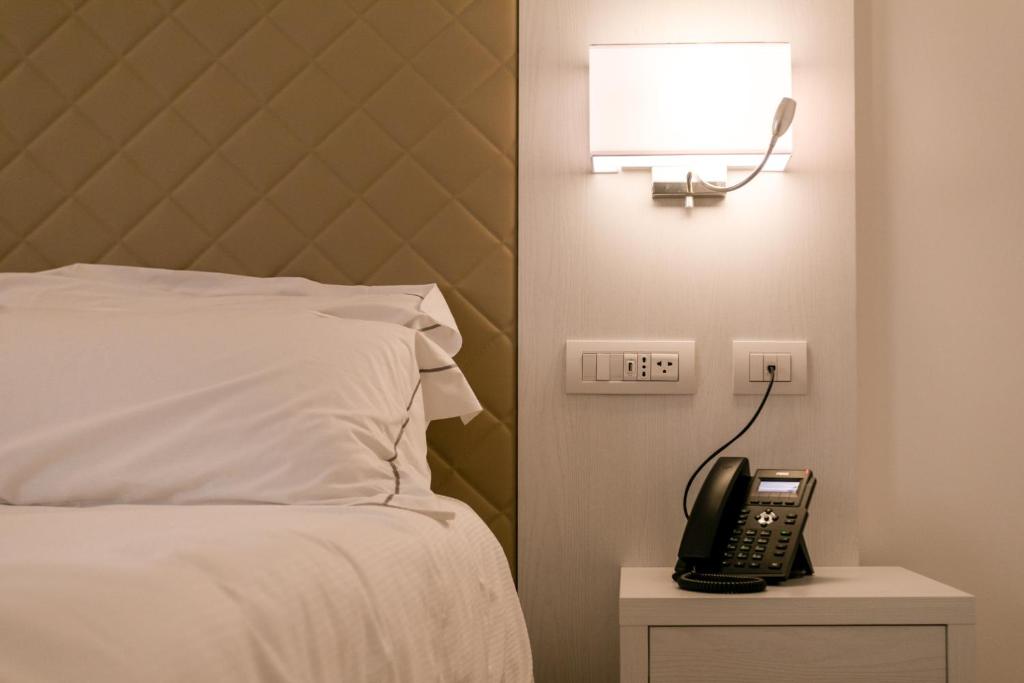 Postel nebo postele na pokoji v ubytování Hotel Moresco
