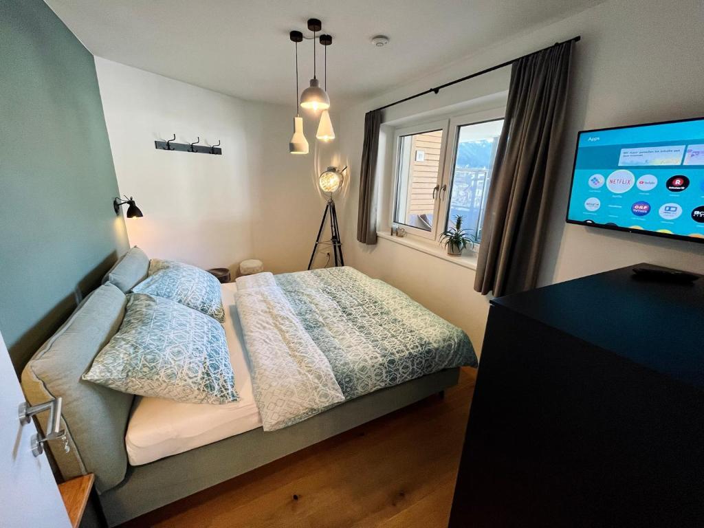 Postel nebo postele na pokoji v ubytování Alpin Art Appartements