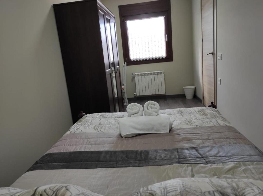 Postel nebo postele na pokoji v ubytování Apartamentos turísticos las 3 Golondrinas