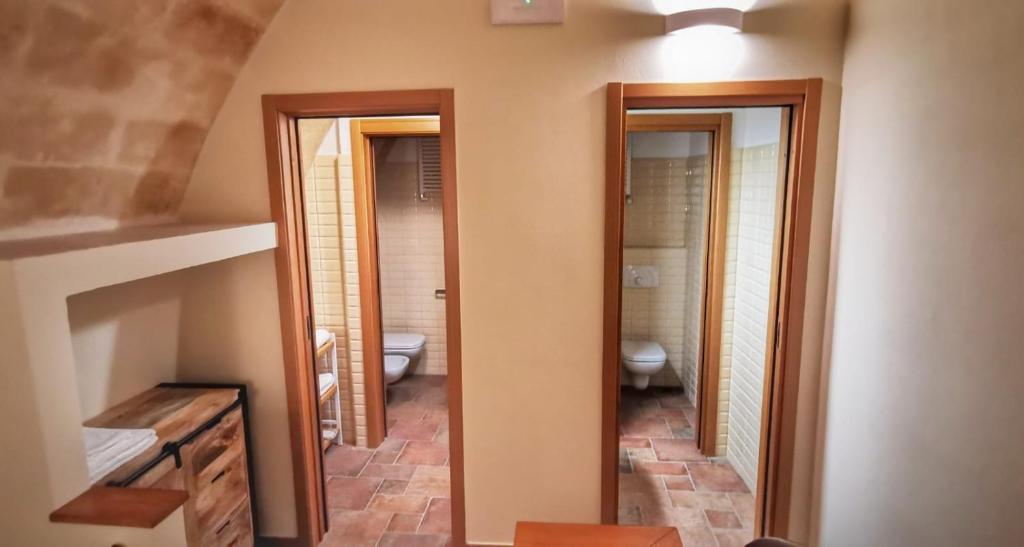 Postel nebo postele na pokoji v ubytování La Cisterna del Vicinato