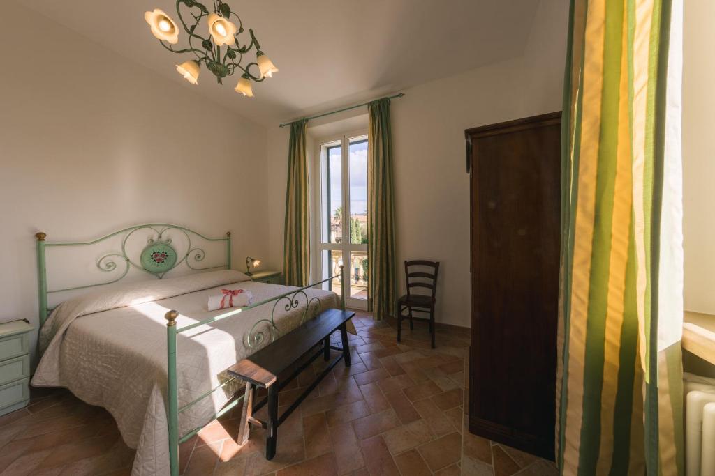 Łóżko lub łóżka w pokoju w obiekcie Villa Toscana Irene
