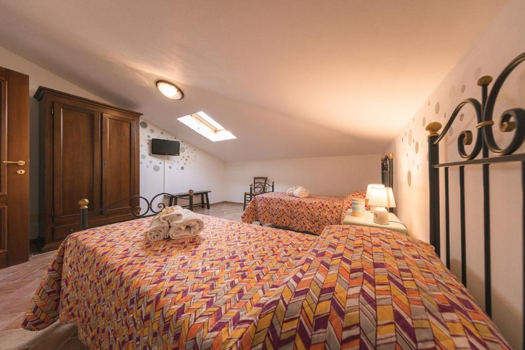 Łóżko lub łóżka w pokoju w obiekcie Villa Toscana Irene