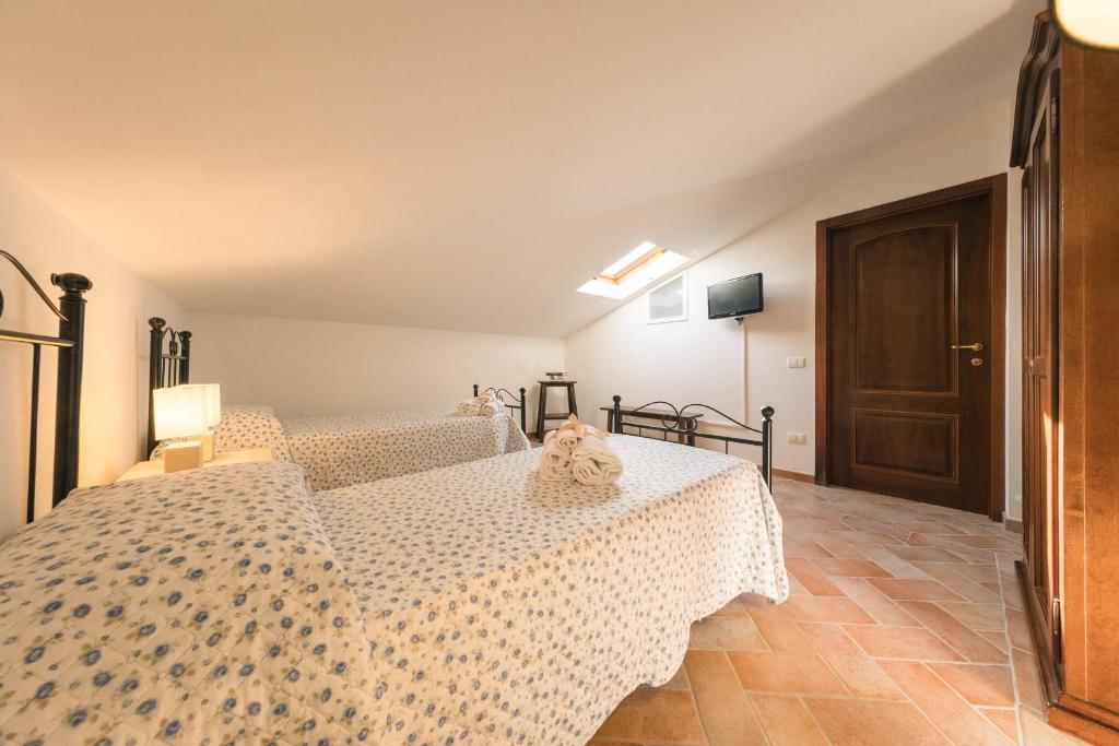 Łóżko lub łóżka w pokoju w obiekcie Villa Toscana Irene