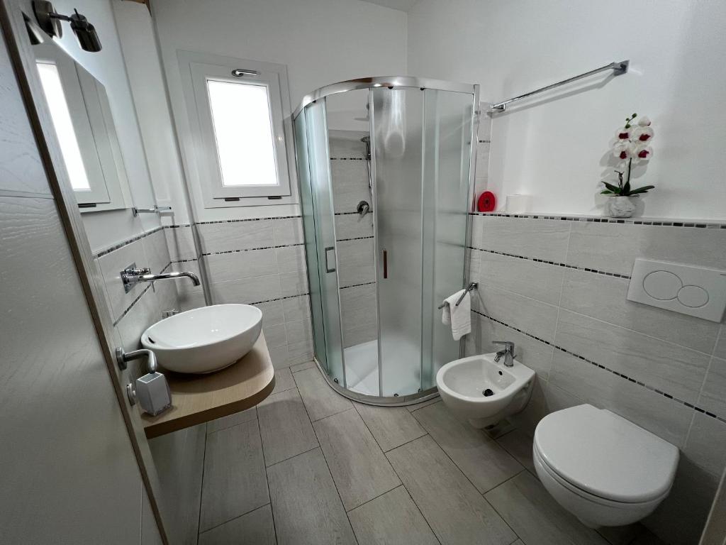 a bathroom with a shower and a toilet and a sink at Al Mare da Francesca in Olbia