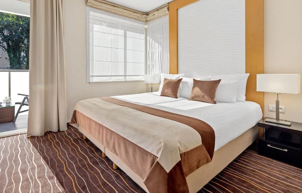 Katil atau katil-katil dalam bilik di Molo Residence