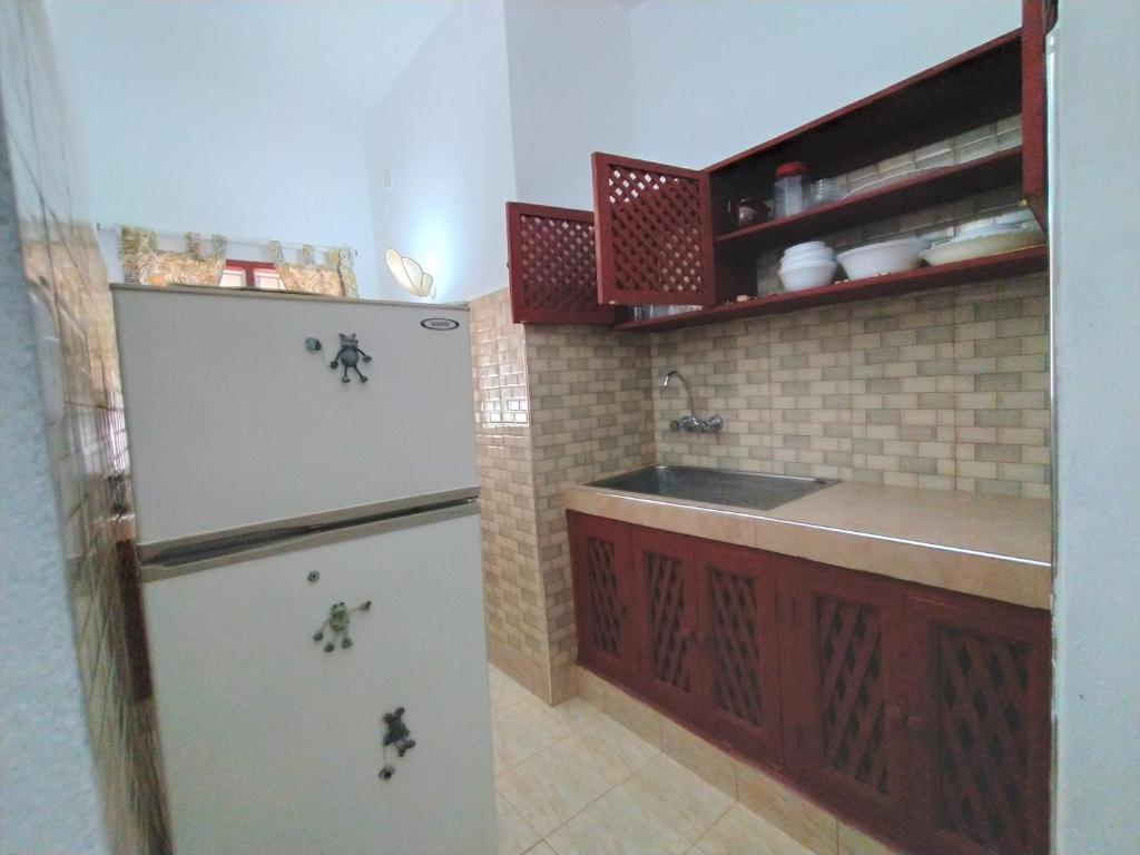 Kuchyň nebo kuchyňský kout v ubytování Karibuni Jeds Villas 85 & 86