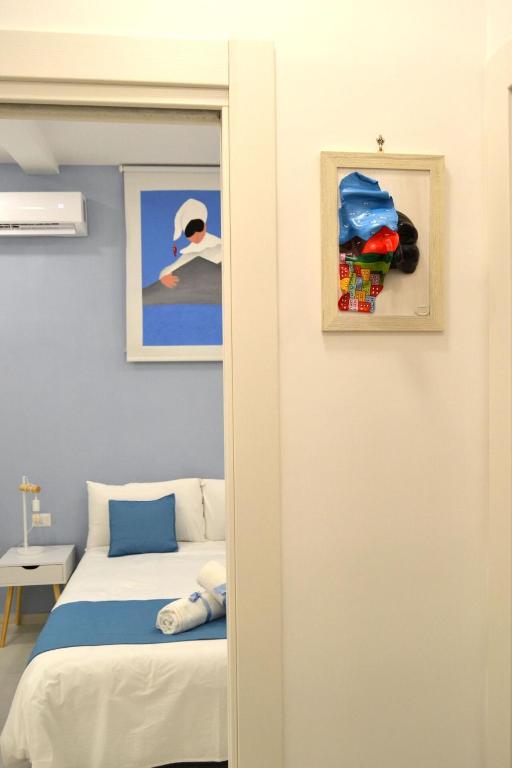 Posteľ alebo postele v izbe v ubytovaní Appartamento I Cenni di Napoli