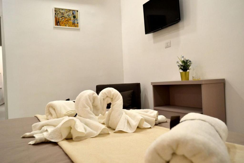 Televízia a/alebo spoločenská miestnosť v ubytovaní Appartamento I Cenni di Napoli